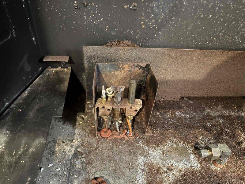 Responded to service call for gas fireplace with suspected thermocouple issue. Upon inspection, discovered severe corrosion throughout the valve assembly, posing significant safety hazard. Diagnosed gas leak at deteriorated connection points and recommended complete valve replacement rather than isolated thermocouple repair due to extensive component degradation.