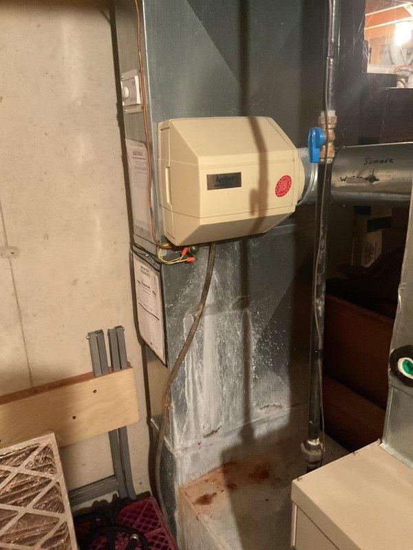 Responded to service call for malfunctioning furnace. Diagnosed water infiltration from Aprilaire Model 550 humidifier. Serviced humidifier system by clearing plugged line, replacing water pad, and thoroughly cleaning drain line. After maintenance, tested system operation to confirm proper functionality and resolve heating issues.