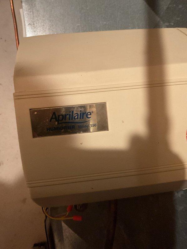 Responded to service call for malfunctioning furnace. Diagnosed water infiltration from Aprilaire Model 550 humidifier. Serviced humidifier system by clearing plugged line, replacing water pad, and thoroughly cleaning drain line. After maintenance, tested system operation to confirm proper functionality and resolve heating issues.