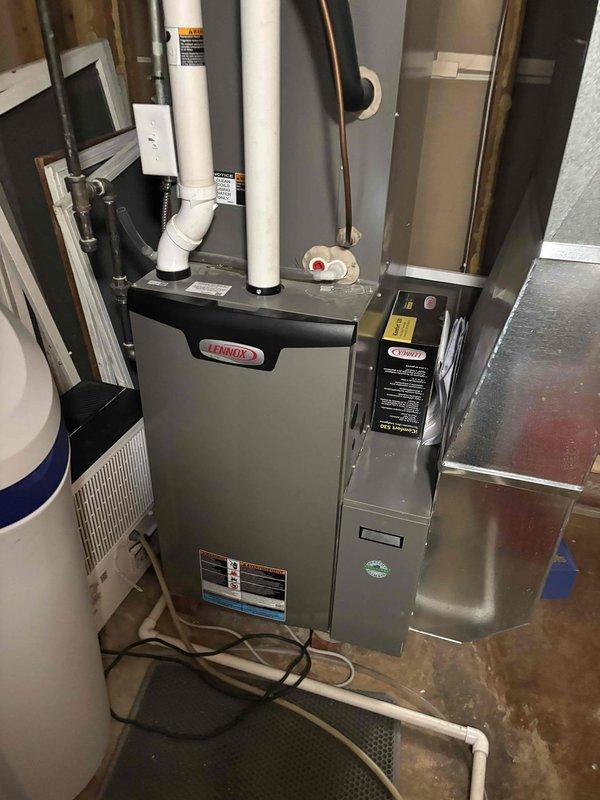 Resolved intermittent operation issue on Lennox heat pump system by replacing defective control board (part #27P17). Inspected and adjusted chassis ground connection by loosening screws for proper alignment. Educated customer on normal heat pump operation characteristics relative to outdoor temperature conditions.