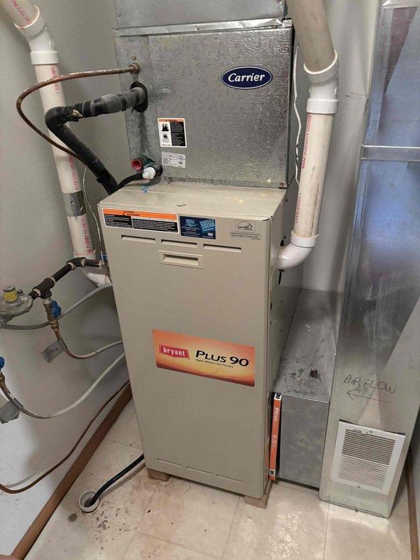 Responded to customer report of water leak from furnace. Upon diagnosis, identified failed secondary heat exchanger in existing Bryant Plus 90 system. Took measurements of the unit and installed new furnace to replace the defective equipment. All connections were properly secured and system operation verified before completion.