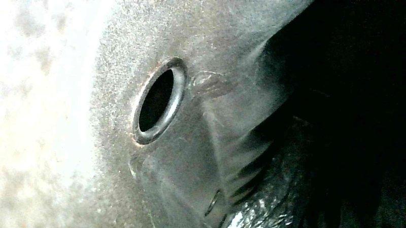 Performed furnace and April Aire humidifier tune-up service. Inspection revealed significant cracks in heat exchanger as documented in photographs. Customer was informed that replacement heating system will be necessary due to compromised heat exchanger integrity.