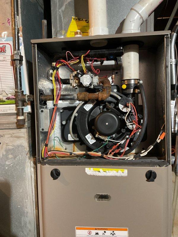 Successfully replaced faulty inducer motor assembly in customer's furnace system. Visual inspection confirmed presence of wiring and component corrosion throughout the unit. Customer was advised to contact for service scheduling via provided phone number.