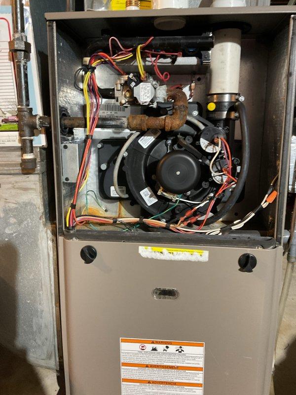 Successfully replaced faulty inducer motor assembly in customer's furnace system. Visual inspection confirmed presence of wiring and component corrosion throughout the unit. Customer was advised to contact for service scheduling via provided phone number.