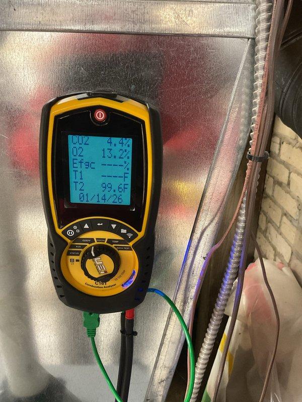 Performed diagnostic testing and tune-up service on 2013 Airflow York Mountain furnace that was not heating properly. Conducted comprehensive system measurements with CRT meter showing temperature readings (T2: 99.6F) and efficiency values (4.4%, 13.2%). Inspected interior components including motor assembly and wiring harnesses, cleaned system, replaced thermostat batteries, and restored proper operation.
