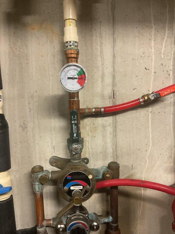 Met with Howard from Hot Water Products to diagnose insufficient heating and hot water issues in the building. Identified a faulty circulation pump and incorrectly installed mixing valve requiring re-piping. Successfully installed new circulating pump to restore proper system function.