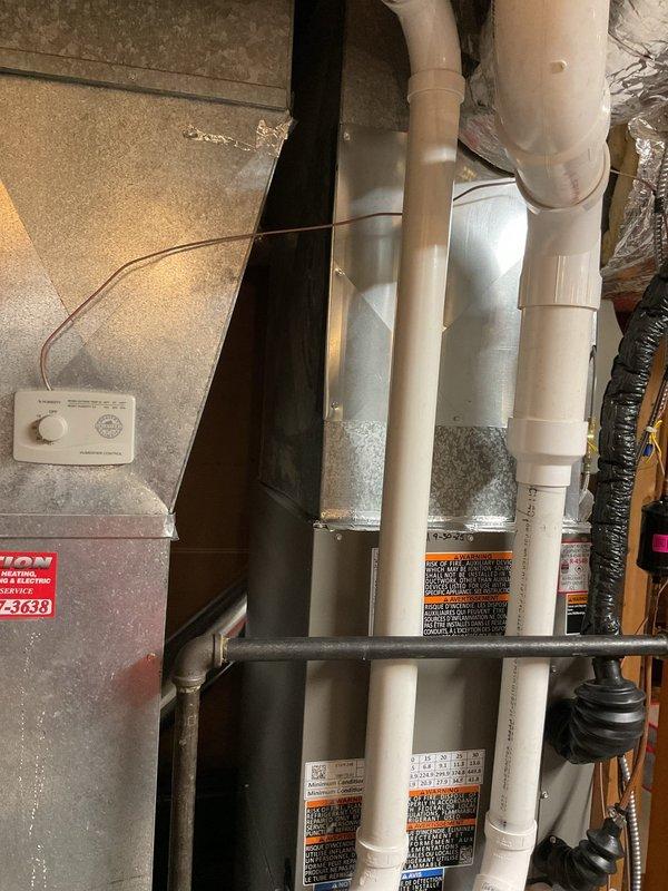 Responded to customer complaint of water leakage from furnace. Inspection of Lennox unit revealed exhaust pipe connection was not properly glued, causing exhaust gases to leak onto furnace. Repaired by properly applying adhesive to the PVC joint and verified proper system operation after repair.
