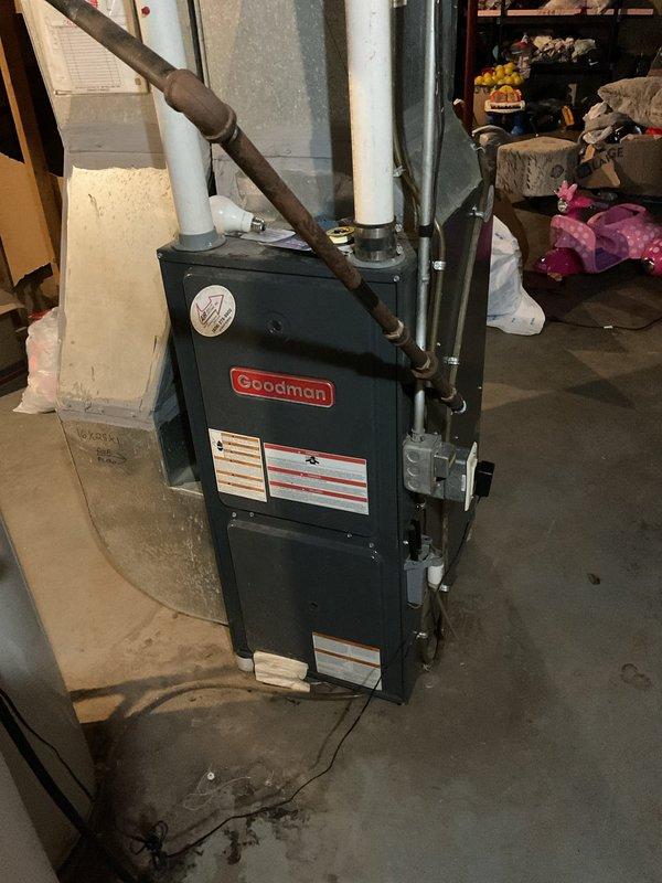 Responded to no-heat call for Goodman furnace that was not igniting. Diagnosed failed combustion air blower as the root cause. Replaced combustion air blower and performed system verification to restore proper heating function.