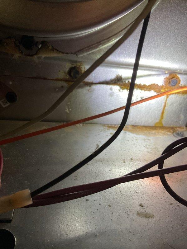 Responded to customer complaint of heating system failure (thermostat set to 71°F with actual temperature at 61°F). Diagnosed issue with flame ignition despite pilot light being on. Performed maintenance on flame sensor and cleaned sensor ports which were showing significant corrosion and rust buildup as documented in photos. System successfully restored to normal operation with proper heating function verified before departure.