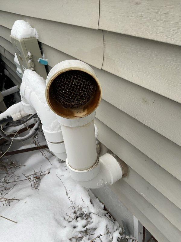 Responded to no heat emergency call where customer reported furnace maintaining temperature below setpoint. Diagnostic testing revealed a cracked heat exchanger leaking carbon monoxide and triggering limit switch shutdowns. Observed discoloration and residue around PVC exhaust vent piping confirming combustion issues. Replaced aging furnace unit to restore safe heating operation and eliminate CO hazard.