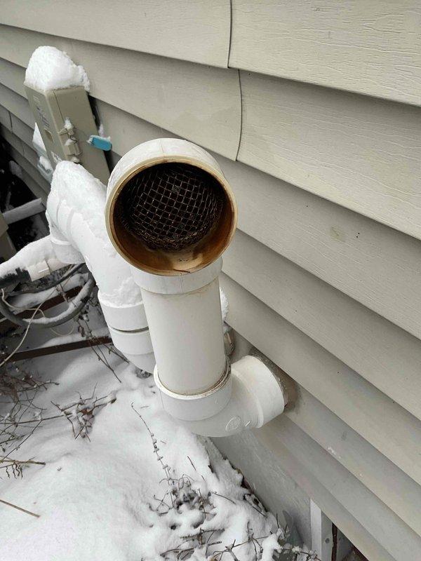 Responded to no heat emergency call where customer reported furnace maintaining temperature below setpoint. Diagnostic testing revealed a cracked heat exchanger leaking carbon monoxide and triggering limit switch shutdowns. Observed discoloration and residue around PVC exhaust vent piping confirming combustion issues. Replaced aging furnace unit to restore safe heating operation and eliminate CO hazard.