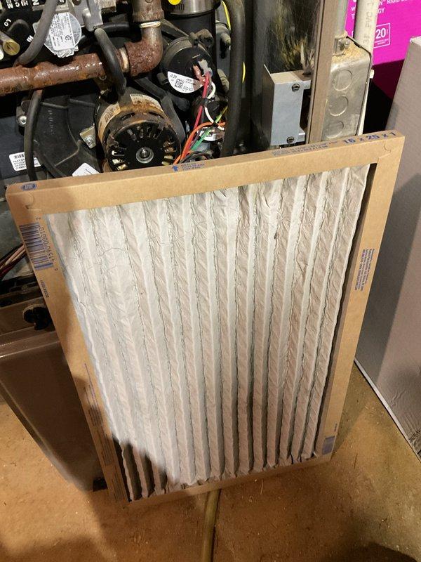 Responded to a call regarding insufficient heat where the system was not keeping up with demand and blower appeared to operate intermittently. Upon inspection, removed front panel to access internal components and examined the blower motor, control board, gas valve assembly, and wiring connections. Installed new air filter to replace existing unit. System was tested and proper operation was restored, resolving the heating performance issue.