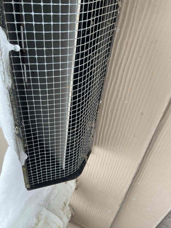 Performed inspection and maintenance of microwave ventilation system. Located exterior vent on side wall, which was found partially open. Sealed all ductwork joints with appropriate tape and adjusted damper mechanism to ensure proper operation and prevent air leakage.