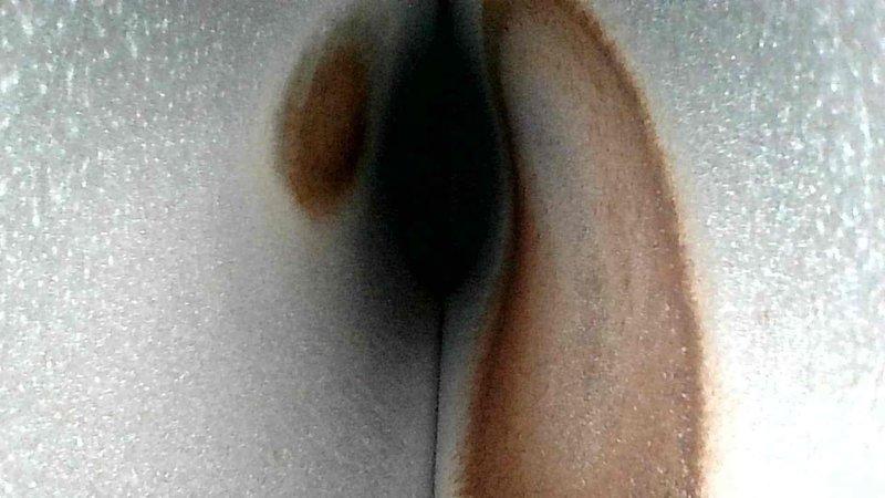 Responded to no heat call for aging furnace not maintaining temperature. Diagnosed clogged condensate drain causing system failure, evidenced by water damage and rust formation near drain area. Cleared blockage, restored proper drainage, and verified system operation.