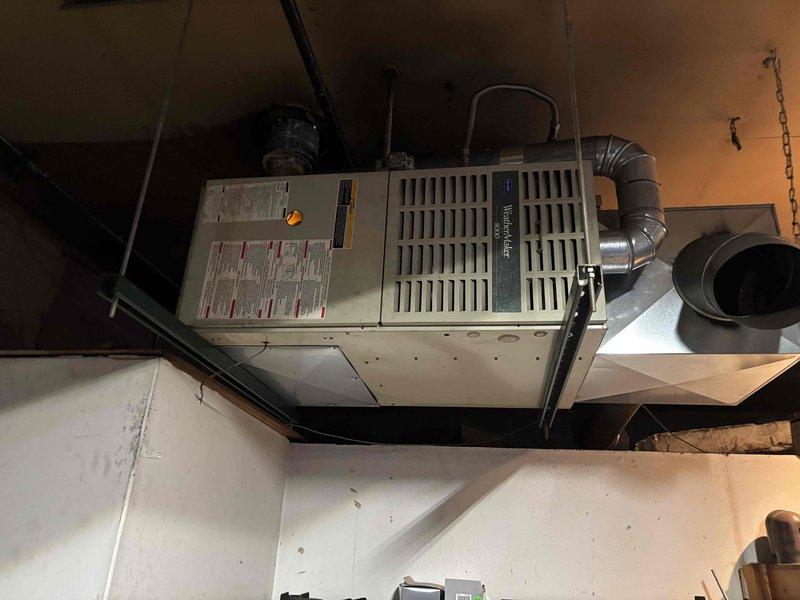 Responded to no-heat call for Spanish-speaking customer. Diagnosed faulty fan control board outputting only 9V. Replaced control board (sourced from AUESTEEL) and installed new thermostat, restoring proper furnace operation and heat function.