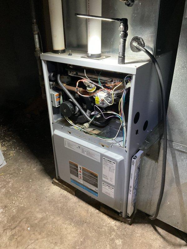 Responded to service call for 2008 gas furnace producing humming and loud noise during operation. Inspection of unit revealed failing inducer motor, which was confirmed by inspection of FASCO motor assembly. Replacement of inducer motor was recommended to resolve the issue.