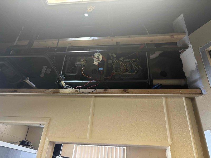 Responded to no heat call at commercial office for 20+ year old system. Diagnosed failed inducer motor, evidenced by compromised copper windings visible through ventilation slots. Installed replacement Fasco inducer motor, restoring system function. Advised customer about discussing furnace replacement with landlord due to system age.