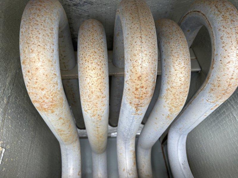 Responded to no heat complaint at RTU. Diagnosed issues with restricted airflow due to severely clogged filters and return grilles. Installed new filters and removed grilles for customer cleaning. Visual inspection revealed significant rust and corrosion on evaporator coils, indicating potential long-term moisture exposure requiring future attention.