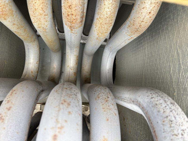 Responded to no heat complaint at RTU. Diagnosed issues with restricted airflow due to severely clogged filters and return grilles. Installed new filters and removed grilles for customer cleaning. Visual inspection revealed significant rust and corrosion on evaporator coils, indicating potential long-term moisture exposure requiring future attention.
