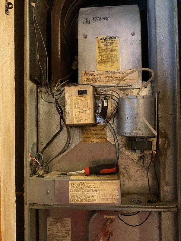 Responded to no-heat call for 25+ year-old mobile home furnace. Diagnostic inspection revealed faulty inducer motor as the source of system failure. Successfully restored temporary operation of the motor, allowing heat function to resume. Noted significant age of unit and visible corrosion on exhaust components that may require future attention.