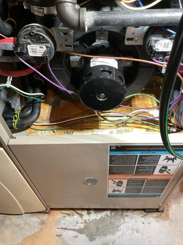 Diagnosed 20-year-old Lennox furnace with no heat issue caused by plugged drain and water accumulation in the inducer motor venturi. Cleared drainage system, cleaned trap, replaced furnace filter, and verified continuous operation after servicing to ensure proper system function.