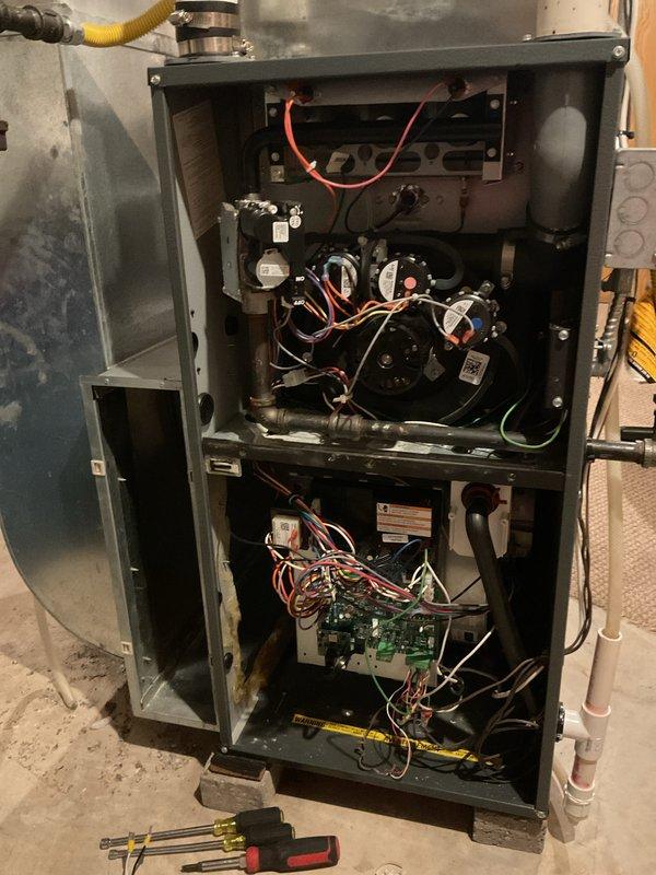 Diagnosed Goodman gas furnace with no heat issue. Visual inspection revealed faulty control board. Sourced and installed replacement Emerson control board, reconnected all electrical terminals, and verified proper operation. System is now functioning correctly with heat restored.