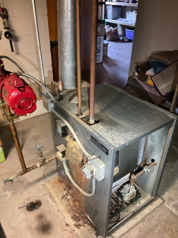 Responded to no-heat emergency; diagnosed low water pressure due to faulty fill valve. Replaced defective fill valve and installed new backflow preventer to restore proper system pressure and heating function.