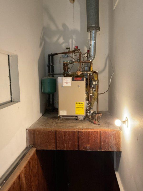 Responded to no-heat service call for a residential boiler system where one zone was not heating the upstairs, kitchen, and den areas. Upon inspection, diagnosed a faulty zone valve preventing proper flow to affected areas. Removed defective zone valve and installed new replacement component, restoring full heating functionality to all zones of the home.