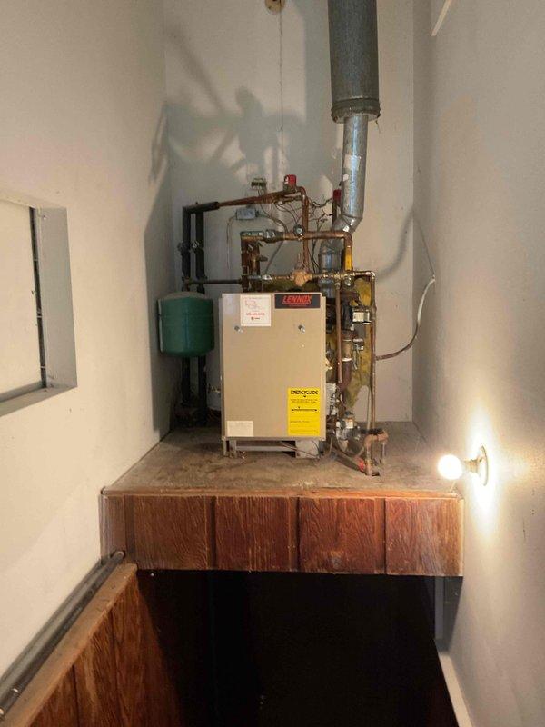 Responded to no-heat service call for a residential boiler system where one zone was not heating the upstairs, kitchen, and den areas. Upon inspection, diagnosed a faulty zone valve preventing proper flow to affected areas. Removed defective zone valve and installed new replacement component, restoring full heating functionality to all zones of the home.