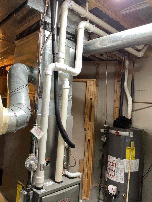 Responded to no heat call and found inducer motor full of water. Cleared all drain lines and collector box to restore furnace operation. Identified improper venting pitch as root cause of recurring water accumulation issues that has previously caused gurgling sounds during startup. Customer advised quote will be provided for permanent repair to correct pitch of PVC venting system.