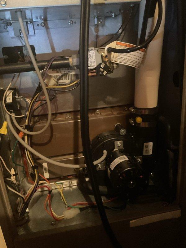 Responded to no heat complaint for customer with 20-year-old York furnace. Diagnosed failed run capacitor causing system failure and slight burning rubber smell. Replaced capacitor, restoring proper furnace operation and heat to home.