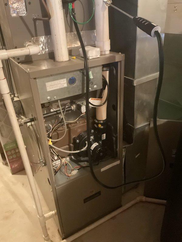 Responded to no heat complaint for customer with 20-year-old York furnace. Diagnosed failed run capacitor causing system failure and slight burning rubber smell. Replaced capacitor, restoring proper furnace operation and heat to home.