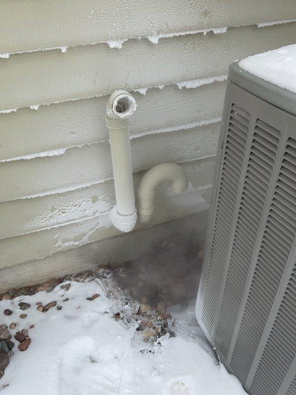 Resolved venting cross-contamination issue with furnace exhaust system that was causing frost buildup and blockage. Discovered improper original venting configuration that allowed condensation to freeze in the exhaust pipe. Properly re-vented outdoor terminations to prevent future blockages and eliminate the need for customer to manually clear the exhaust pipe.