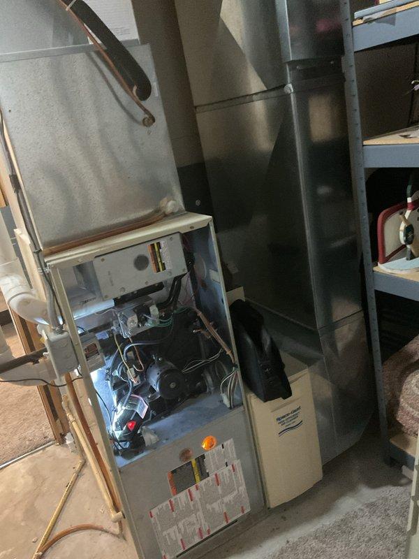 Diagnosed no heat issue on older Carrier furnace. Found thermostat malfunction causing system failure to initiate heating cycle. Accessed furnace control board to verify power supply and component functionality. Repaired thermostat wiring connections and recalibrated temperature settings, restoring normal heating operation.