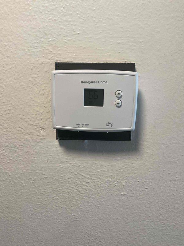 Responded to no heat service call for rooftop unit that had previously been serviced twice this month. Diagnosed thermostat issue displaying error code "00" on Honeywell Home digital thermostat. Reset controls and restored proper heating function, confirming system operation before departure.