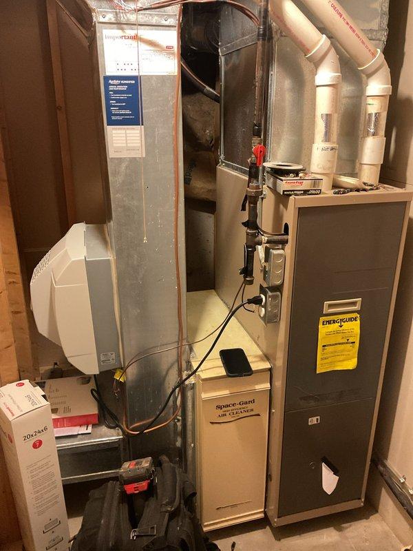 Responded to emergency no-heat call for 20-year-old residential furnace system. Diagnostic testing with UEi CO95 Carbon Monoxide Detector revealed unsafe CO levels of 23 PPM in the home. Upon inspection of the aging furnace and Space-gard air cleaner system, determined unit had failed beyond repair. Recommended replacement with new furnace to restore safe heating function.