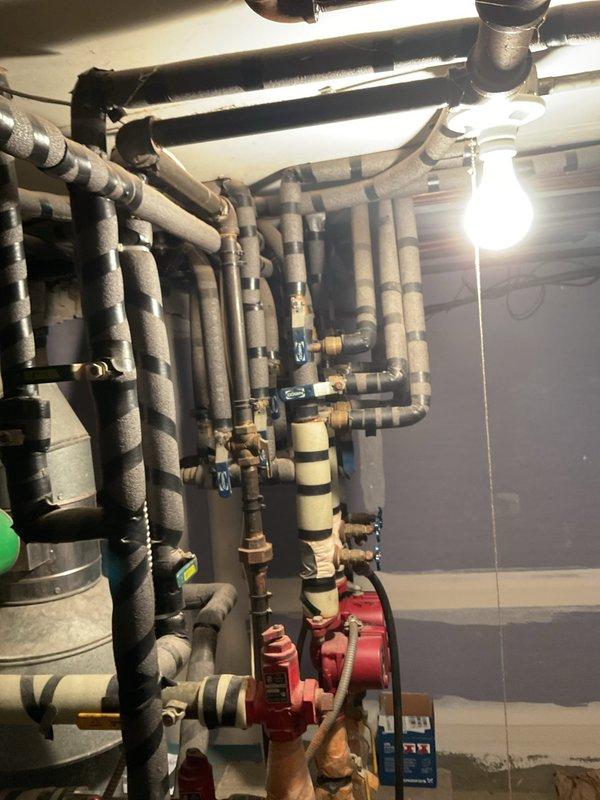 Responded to emergency service call for a 75-year-old boiler system with no heat complaint. Diagnosed air entrainment in the hydronic system causing circulation issues and heat transfer failure. Purged air from the system and recharged the boiler to proper operating pressure, restoring normal heating function and verifying absence of air in circulation loop.