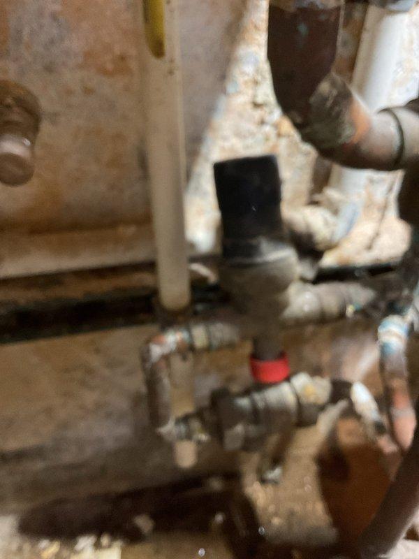 Responded to no-heat service call for boiler system. Diagnosed low water pressure issue affecting downstairs heating. Charged air tank and restored system pressure after determining the fill valve was malfunctioning. Used adjacent boiler's water supply to properly pressurize the system.