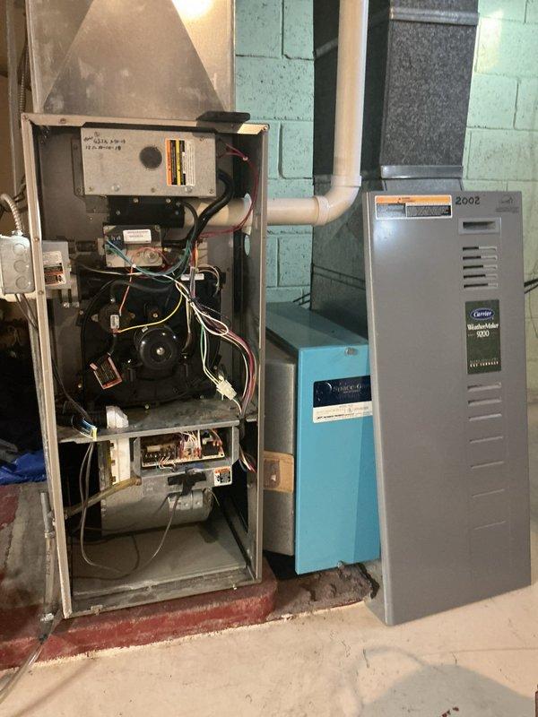 Responded to service call regarding furnace noise and heating concerns. Upon inspection, found Carrier WeatherMaker 8000/Infinity 80 (2002 model) operating but producing excessive vibration. Determined furnace is functional but likely undersized for the recently modified ductwork, causing operational noise. Recommended new furnace installation to properly match current system requirements.