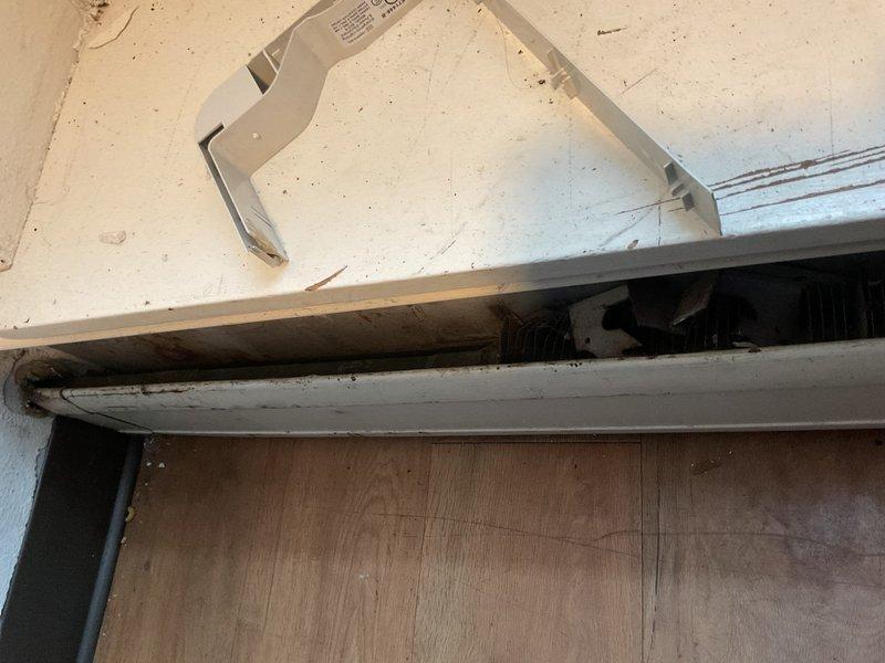 Responded to no heat complaint in room 002. Discovered dual issues: plugged toilet and frozen baseboard heating system. Extracted foreign object (toothbrush) from toilet restoring functionality. Verified zone valve operation and proper valve positions on heating system. Determined baseboards had frozen due to air conditioner operation in basement and upper floor. Deployed temporary heaters to thaw frozen baseboard piping.