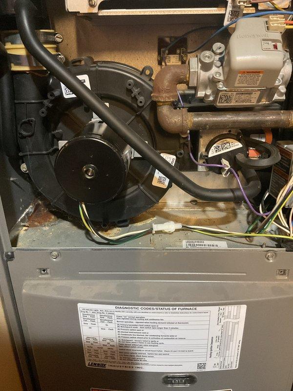 Completed diagnostic assessment on 10-year-old Lennox furnace not heating properly. Inspection revealed signs of corrosion on copper pipes and aging components in the gas valve assembly. Serviced the unit by cleaning connections and verifying proper operation of the recently replaced thermostat to restore adequate heating function.