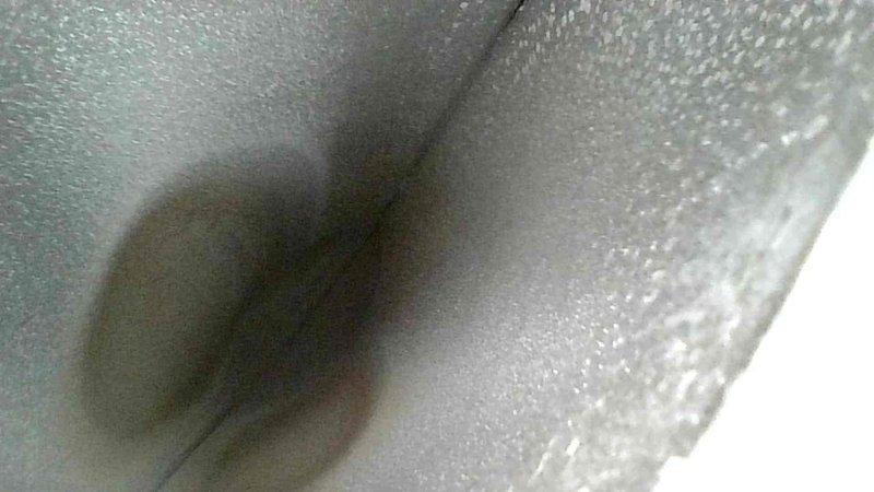 Diagnosed and serviced 10-15 year old furnace with no heat complaint. Found pressure switch stuck and cleared condensate drain lines to restore proper operation. System is now heating correctly. Customer was away; accessed home via garage code as arranged.