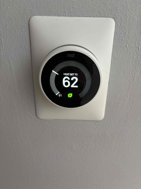 Diagnosed and serviced 10-15 year old furnace with no heat complaint. Found pressure switch stuck and cleared condensate drain lines to restore proper operation. System is now heating correctly. Customer was away; accessed home via garage code as arranged.