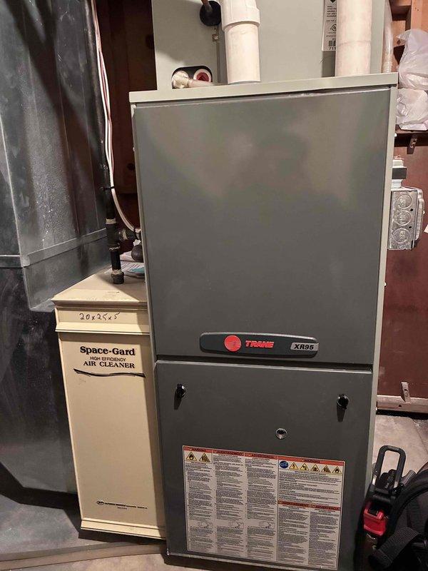 Performed scheduled heating maintenance tune-up on Trane XR86 furnace system with attached Space-Gard 20x25x5 air cleaner. Inspected electrical components with SC680 clamp meter showing 18.3A current draw during operation, which is within normal parameters. Verified filter was in good condition and system is functioning properly for the heating season.