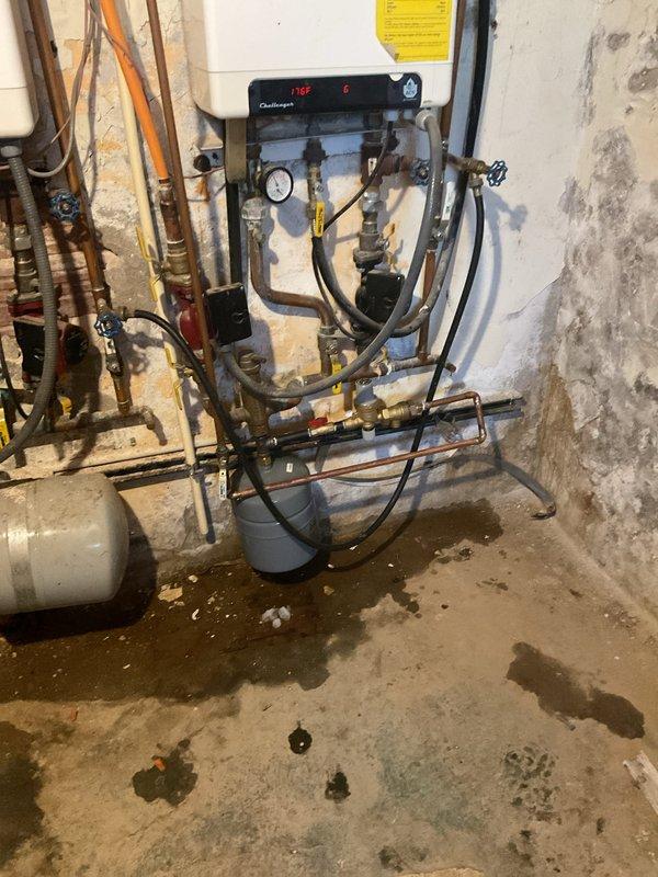 Responded to service call regarding system water pressure issues. Replaced deteriorated autofill valve, backflow preventer, and expansion tank on Challenger boiler system that showed signs of leakage. Verified proper operation of new components with system pressure stabilized at 6 PSI.