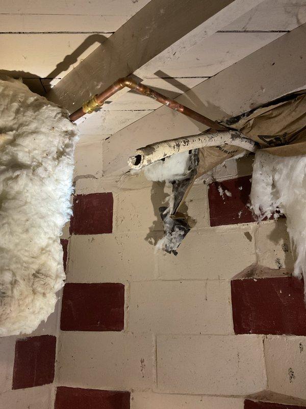 Responded to no-heat call for boiler service. Performed electrical diagnostics using multimeter on control panel, identifying faulty connection in primary circuit. Repaired electrical issue and verified proper voltage to ignition system. Inspected copper distribution piping in basement, found evidence of previous freeze damage, and wrapped exposed sections with insulation to prevent future freezing. System now operational with heat restored.