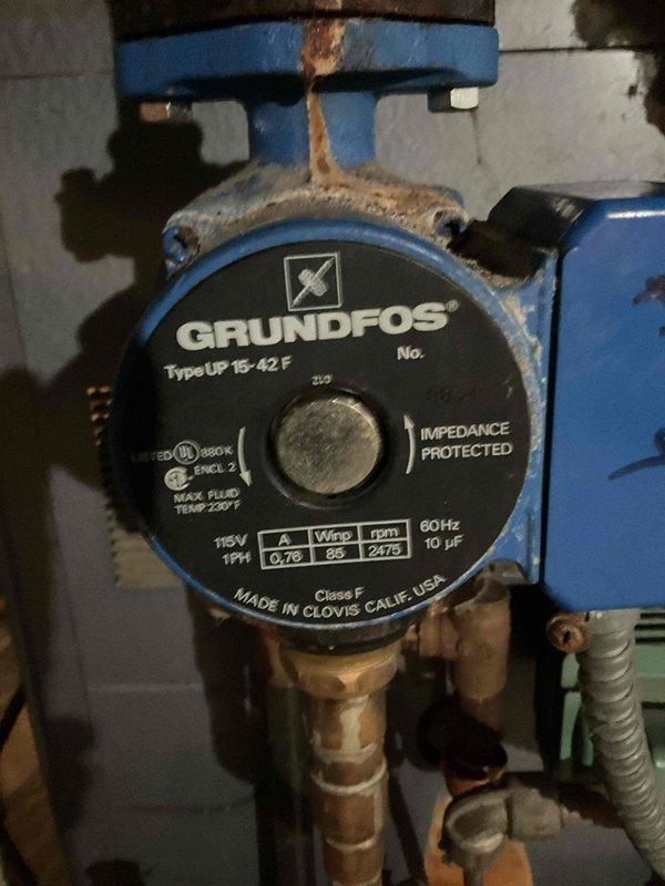 Responded to no heat call for zone four apartment. Diagnosed faulty Grundfos UP 15-42F circulating pump showing erratic current readings and poor performance. Replaced pump and severely deteriorated shut off valve. System had significant copper pipe corrosion requiring careful service to maintain system integrity.