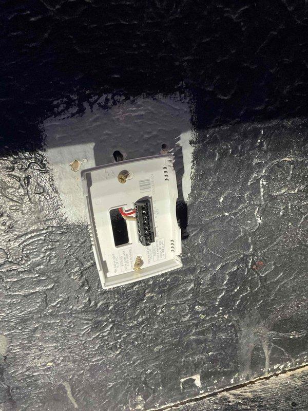 Responded to no heat complaint in Room 002. Discovered frozen radiator due to open window near unit and cold air infiltration from air conditioner. Found damaged zone valve locked in open position and thermostat detached from wall. Temporary heat source placed near radiator to address immediate heating needs. Return visit scheduled to replace zone valve top and install new thermostat.