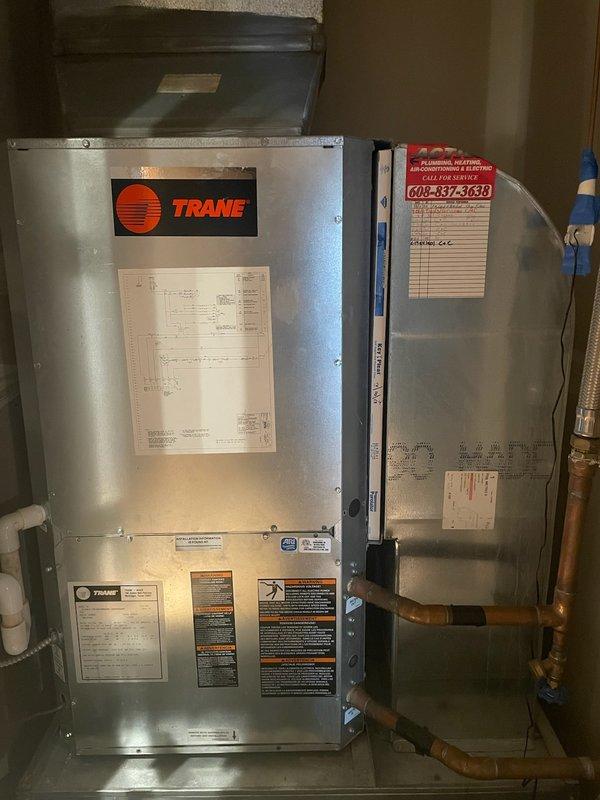 Performed annual heat pump system tune-up including filter replacement (20x25x1). Inspected Trane system, verifying capacitors and contactor in good condition. Addressed thermostat mounting issue - previous Nest thermostat had inadequate wall attachment causing connection problems. Installed new thermostat with proper mounting, successfully configuring for both heating and cooling operation. Noted low temperature split (8°/7°) and recommended condenser cleaning before summer season.