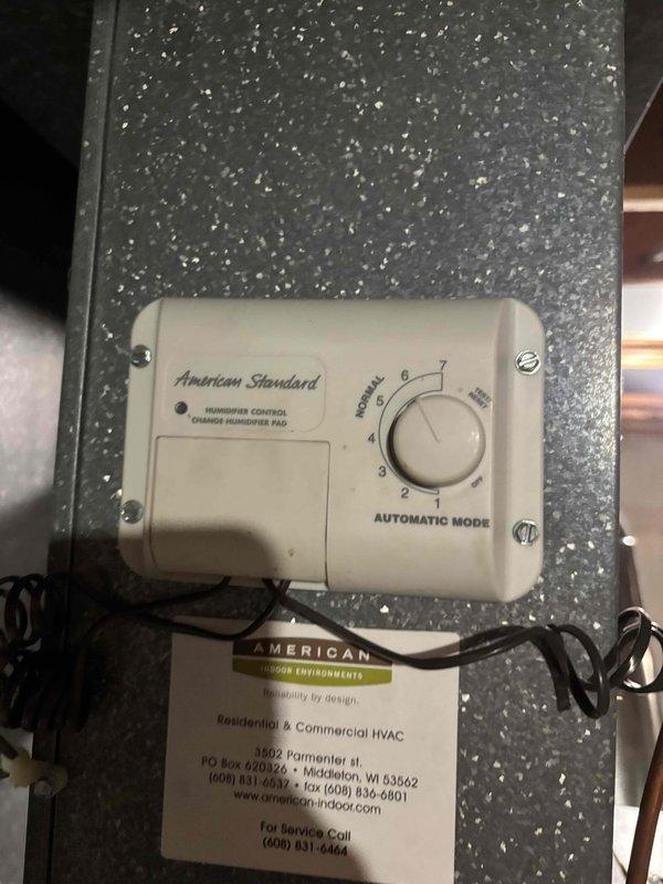 Diagnosed and serviced Aprilaire humidifier system with humidity control issues. Inspected American Standard humidifier control unit set to "AUTOMATIC MODE" and identified faulty saddle valve as primary cause of malfunction. Replaced valve and provided quote for humidistat replacement to restore proper system functionality.